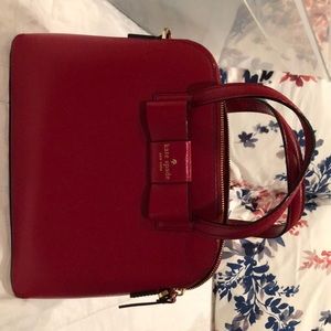 A dark red Kate spade purse